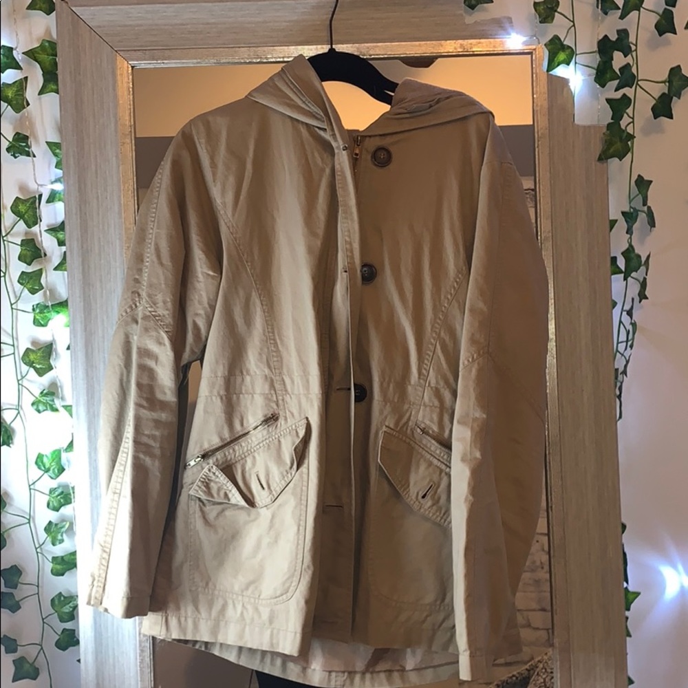 tan zip up and button up winter jacket.